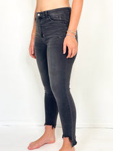 Load image into Gallery viewer, Black Nail High Rise Distressed Step Hem Skinny Jeans
